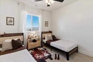 Bedroom with carpet and a ceiling fan