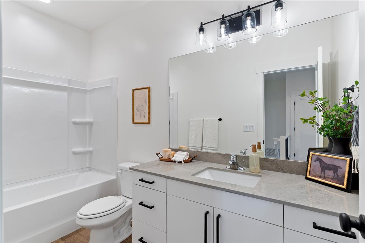 Full bathroom featuring vanity and bathing tub / shower combination