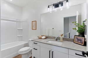 Full bathroom featuring vanity and bathing tub / shower combination