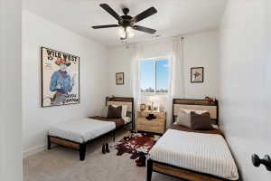 Bedroom with carpet floors and a ceiling fan