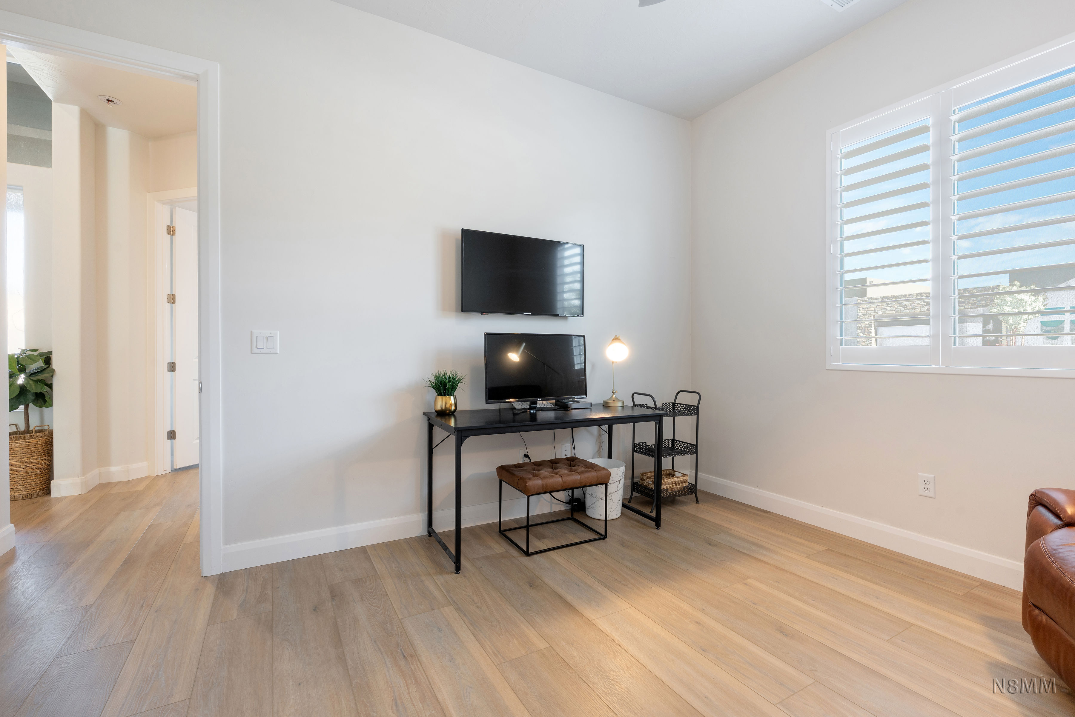 Office area featuring light wood-style flooring and plenty of natural light