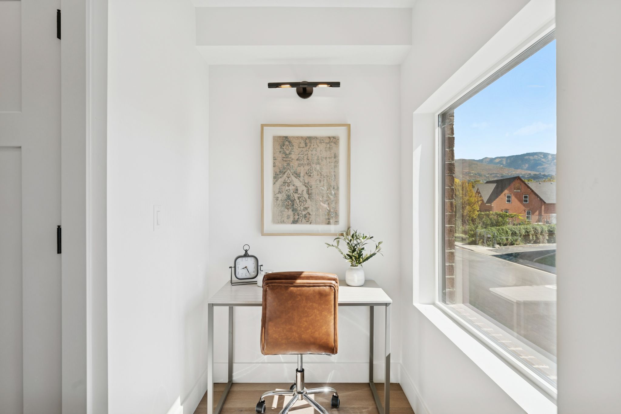 Office space with baseboards and wood finished floors