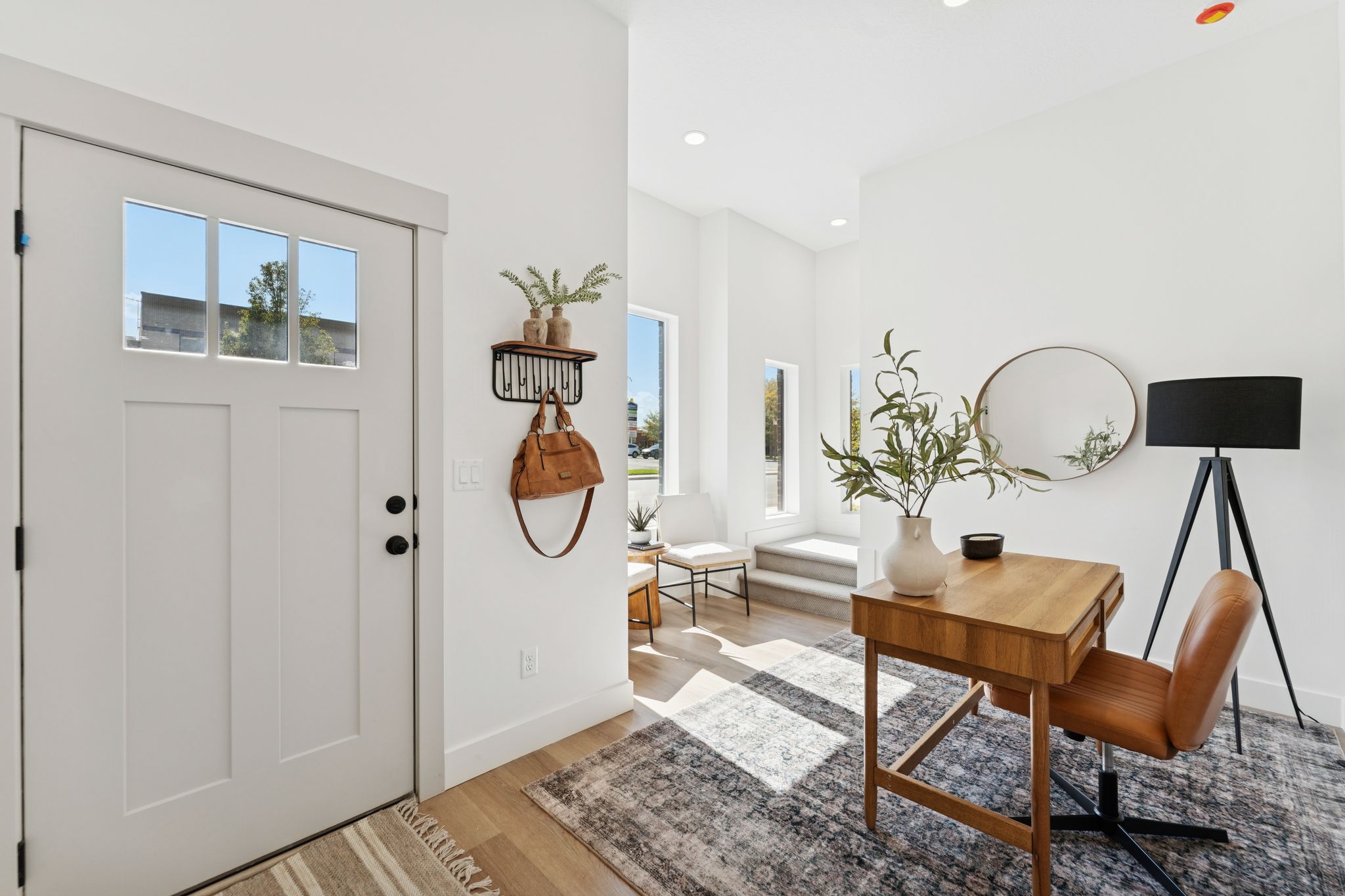 Entrance foyer featuring light wood finished floors and recessed lighting