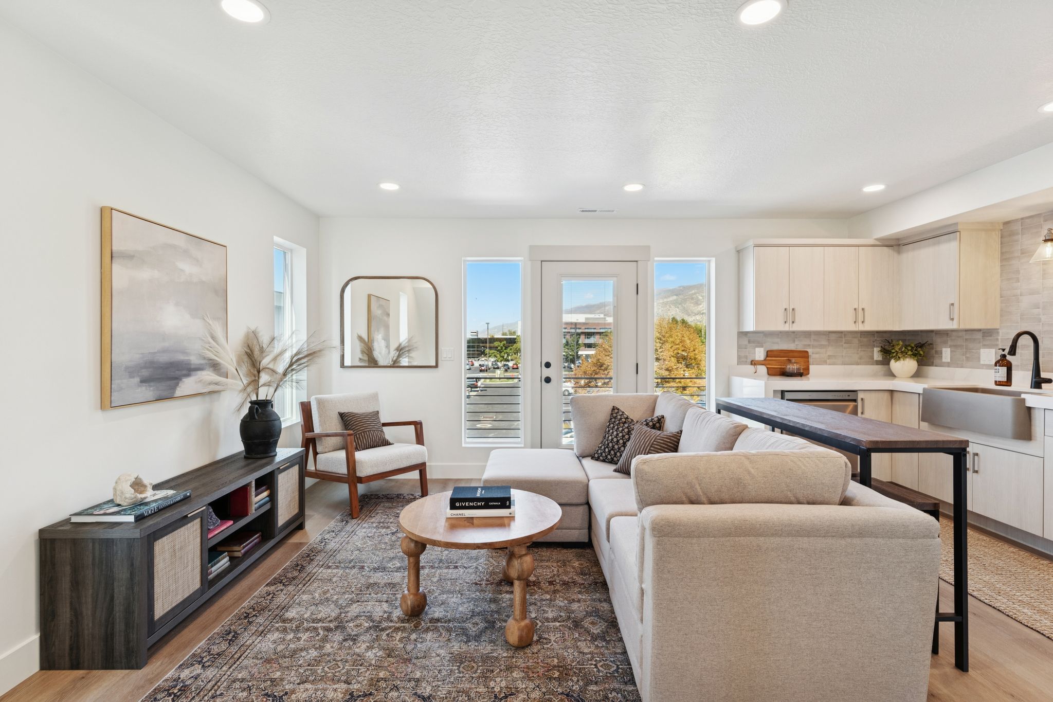 Living room with light wood-style floors and recessed lighting