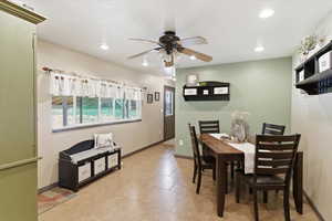 Dining room featuring ceiling fan and recessed lighting