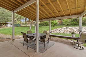 View of patio featuring outdoor dining area