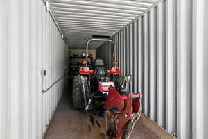Included Mahindra tractor with backhoe and loader bucket