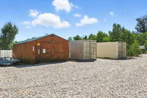 Included workshop and 2 storage containers