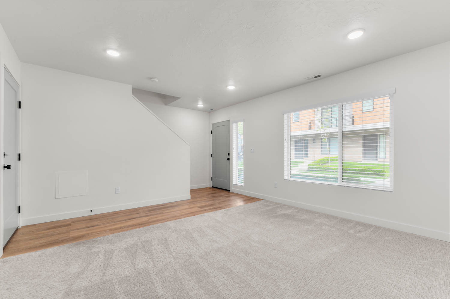 Entryway featuring recessed lighting and light colored carpet