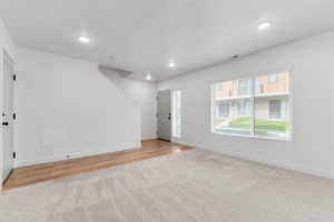 Entryway featuring recessed lighting and light colored carpet