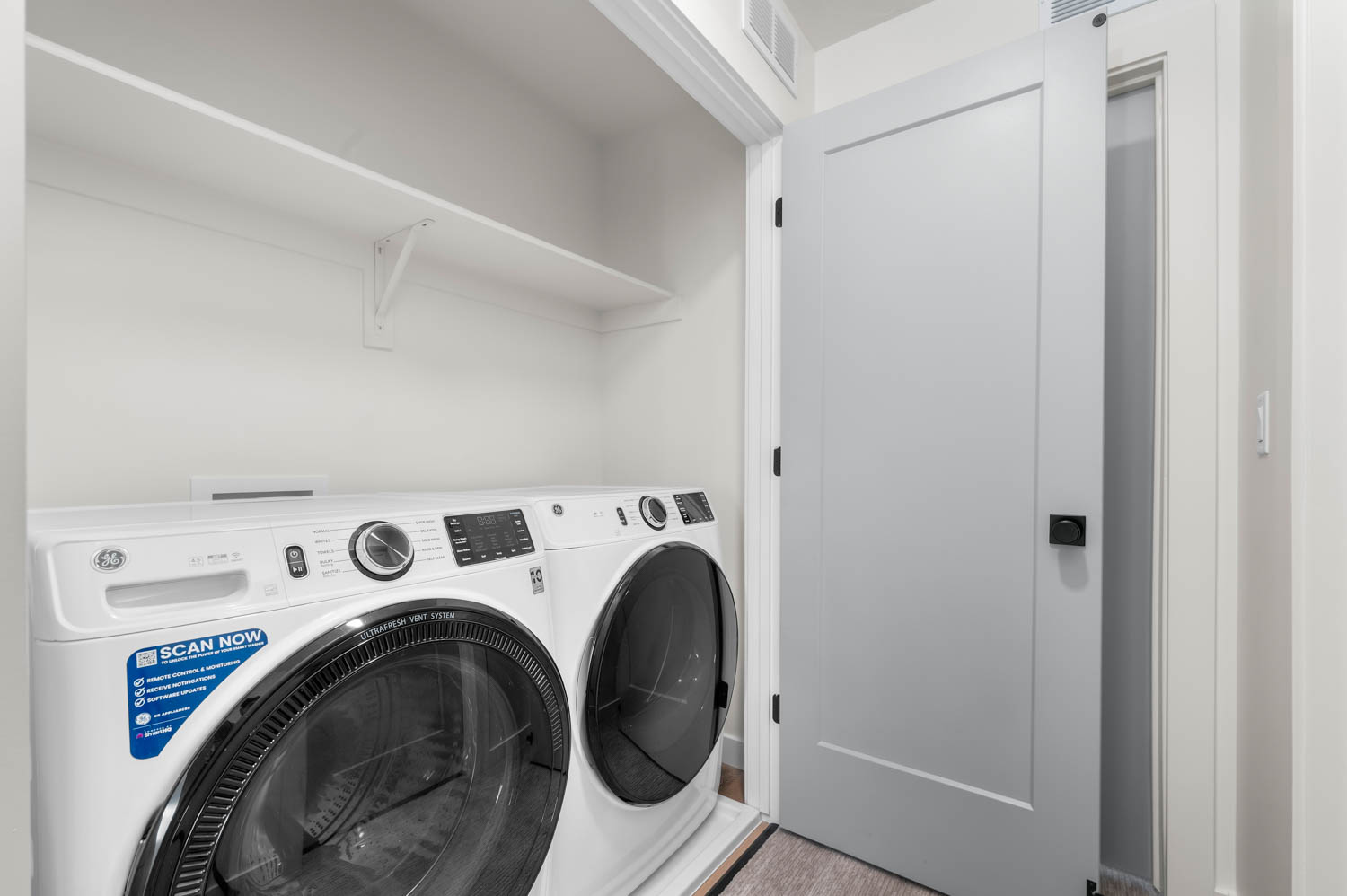 Laundry area featuring separate washer and dryer