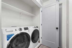 Laundry area featuring separate washer and dryer