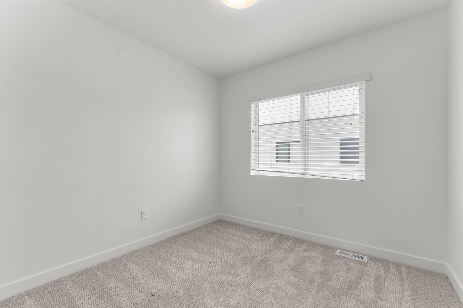 Unfurnished room featuring baseboards and carpet floors