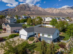 Aerial view of residential area featuring mountains