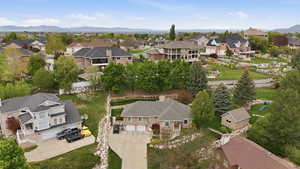 Aerial view of residential area featuring a mountain backdrop