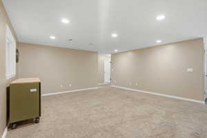Basement featuring light carpet and recessed lighting