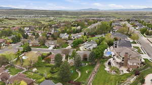 Aerial overview of property's location featuring a mountainous background and nearby suburban area