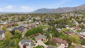 Aerial view of property's location featuring mountains and nearby suburban area