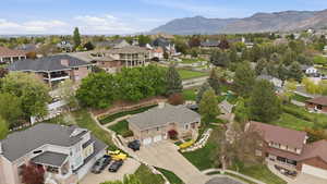 Aerial perspective of suburban area with a mountainous background