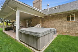 View of patio / terrace featuring a hot tub