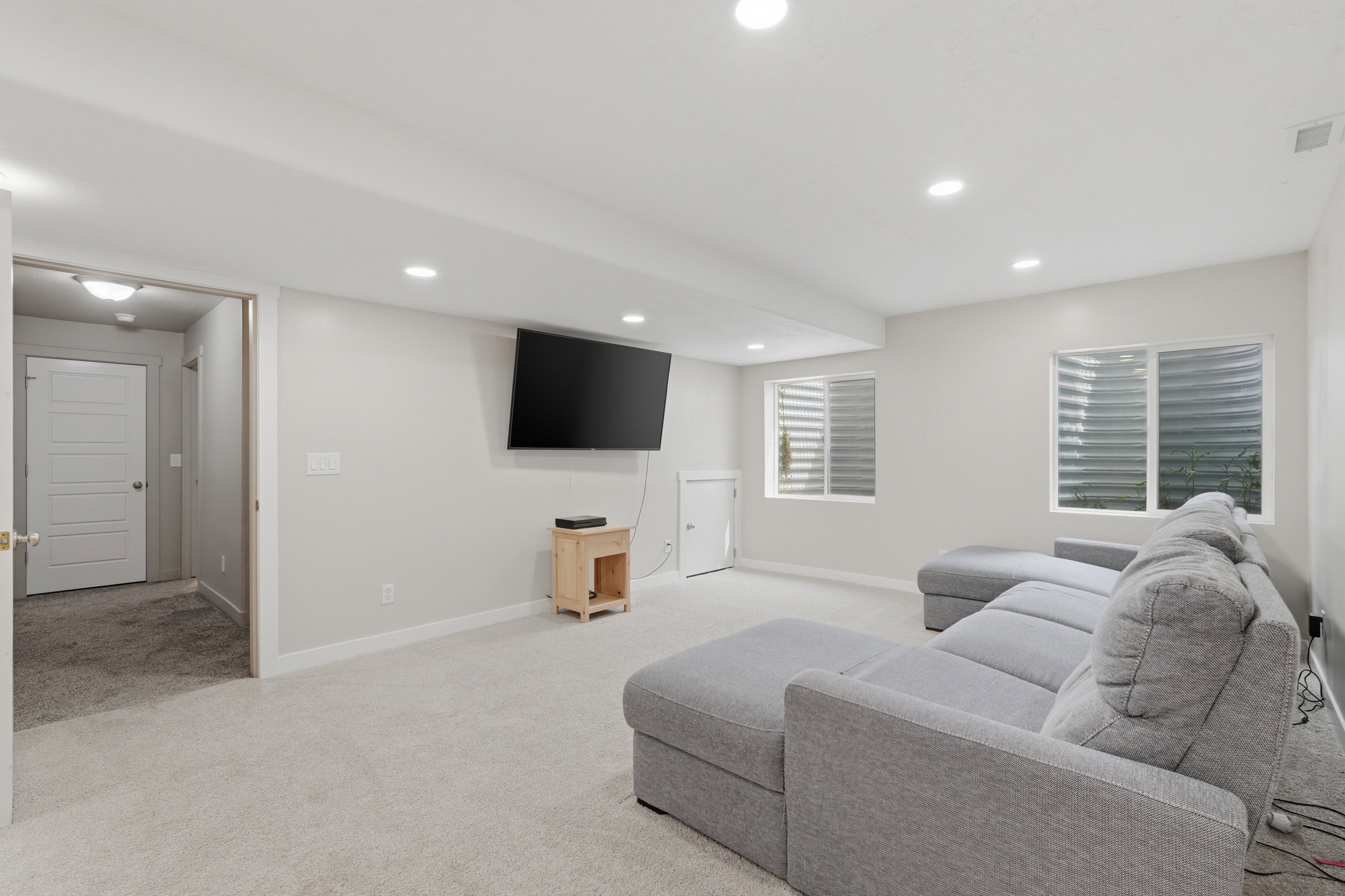 Family room featuring light carpet and recessed lighting