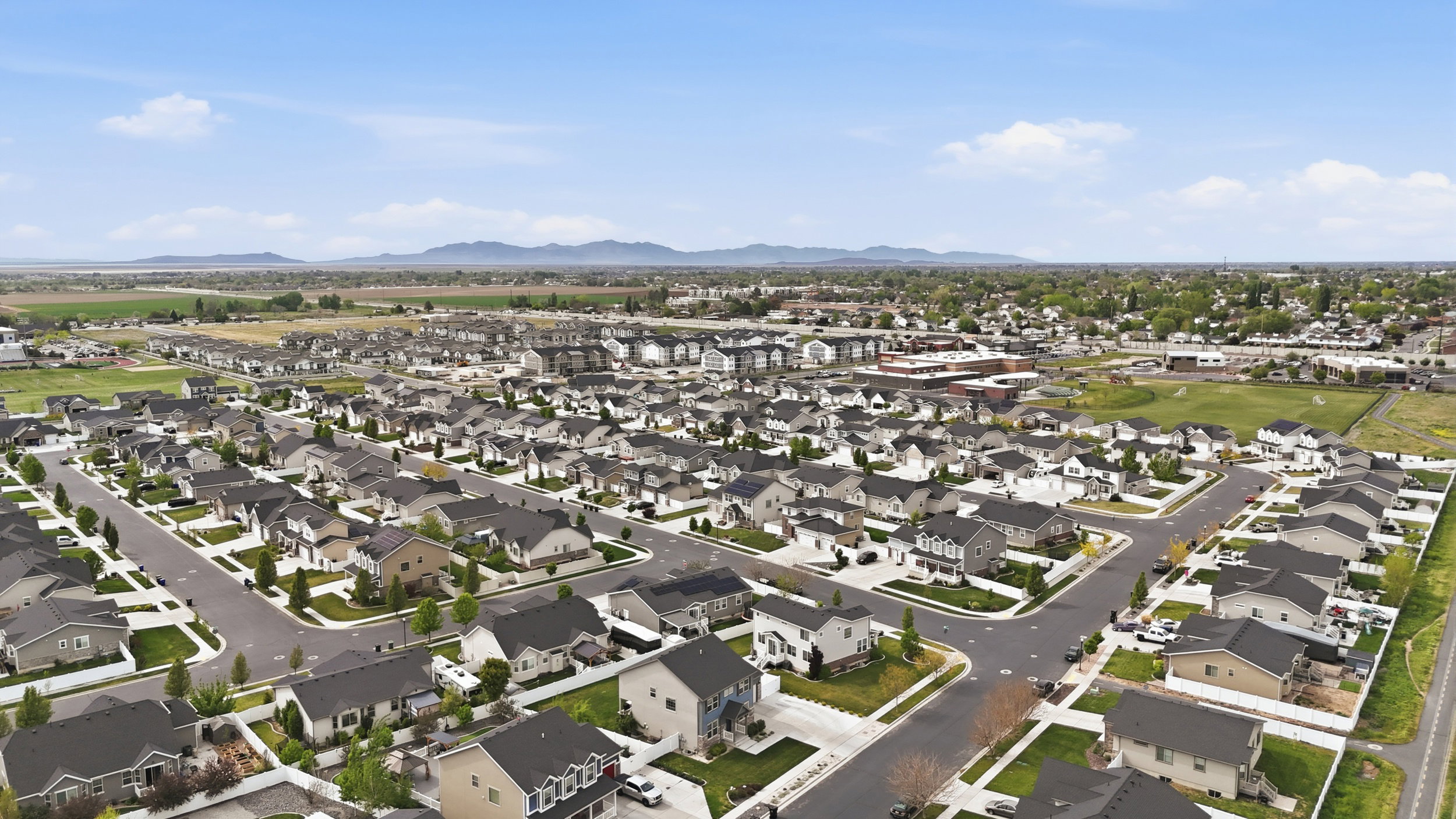 Aerial view of residential area featuring mountains