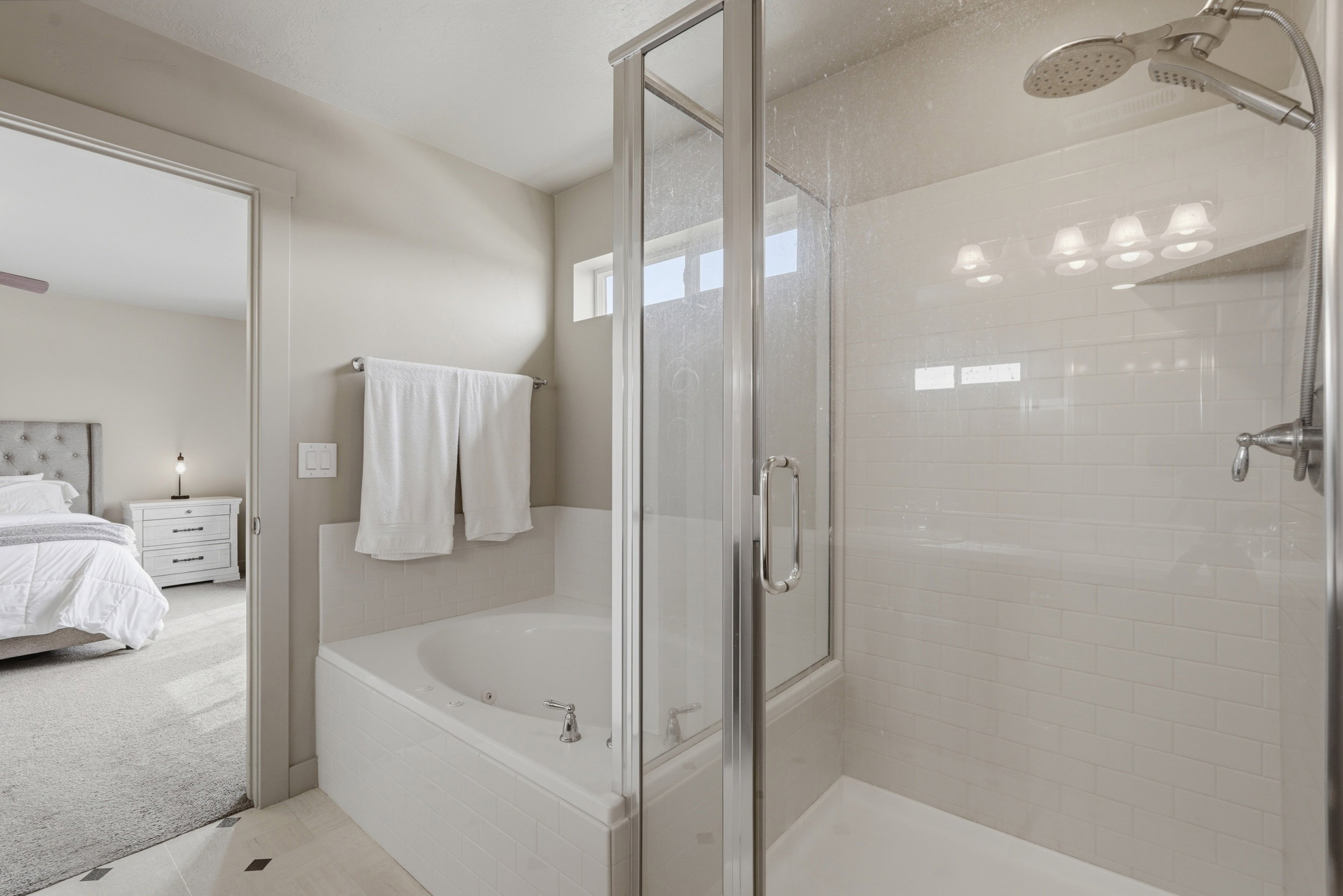primary bathroom ensuite separate bath and shower