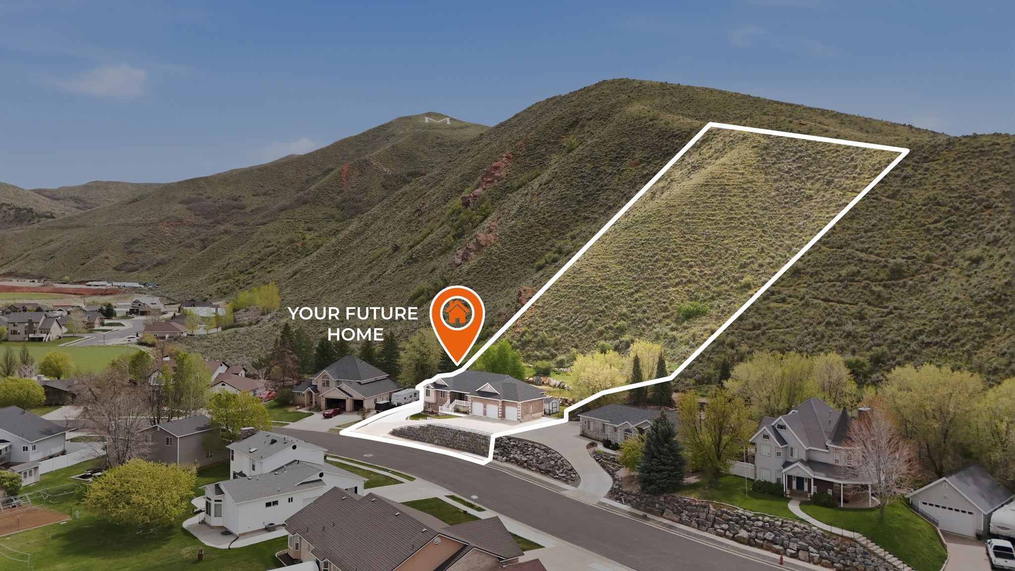 Aerial perspective of suburban area featuring mountains and property boundaries highlighted