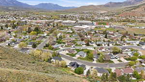 View of property location with a mountainous background and nearby suburban area