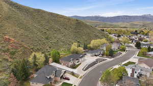 Aerial perspective of suburban area featuring a mountain backdrop