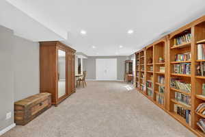 Sitting room featuring light colored carpet and recessed lighting