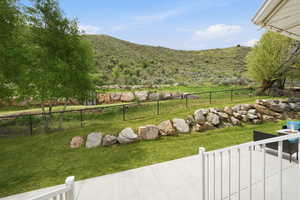 View of yard featuring a mountain view and a patio area