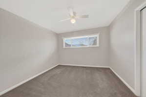 Unfurnished room with carpet and ceiling fan