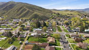 Aerial overview of property's location featuring nearby suburban area