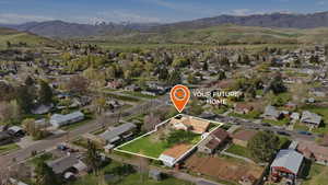 Aerial view of property's location featuring property boundaries highlighted and nearby suburban area