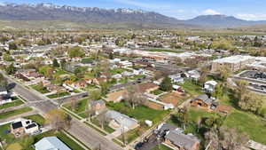 Aerial perspective of suburban area featuring a mountain backdrop
