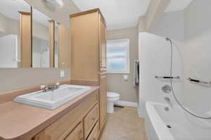 Bathroom with vanity and light tile patterned floors