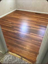 Detailed view of Hardwood floors that are underneath the carpeted floors.