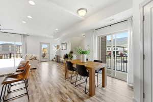 Dining area featuring plenty of natural light, light wood-style floors, recessed lighting, and a mountain view