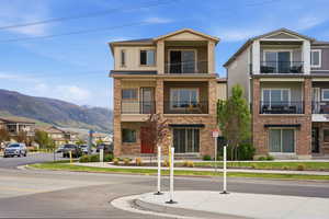 View of building exterior with a residential view and a mountain view