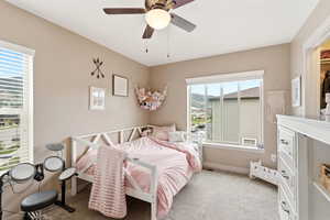 Bedroom with carpet and ceiling fan