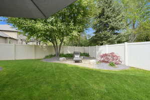 Fenced backyard featuring a patio