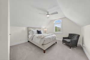 Bedroom with light carpet and ceiling fan