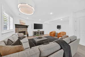 Living area featuring a fireplace and recessed lighting