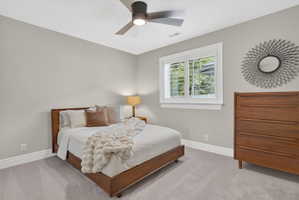 Bedroom featuring ceiling fan and light carpet