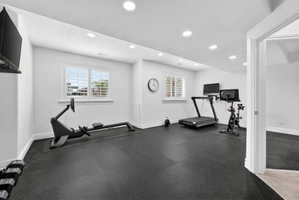 Exercise room featuring recessed lighting and a textured ceiling