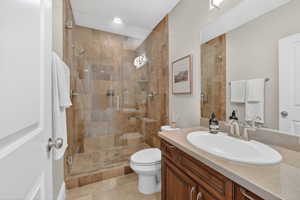 Bathroom with vanity and a shower stall