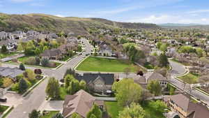 Aerial view of residential area featuring a mountainous background