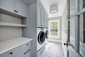 Laundry room featuring cabinet space and washing machine and dryer