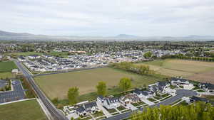 Aerial perspective of suburban area with a mountainous background